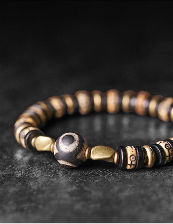 🤍 Bracelet en os de yak sculpté & bois d’ébène – Perle DZI tibétaine Œil protection et abondance – Bijou artisanal spirituel unisexe 🤍