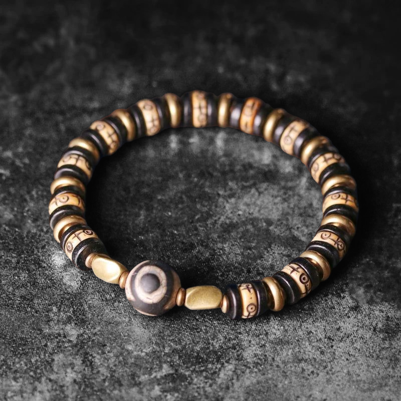 🤍 Bracelet en os de yak sculpté & bois d’ébène – Perle DZI tibétaine Œil protection et abondance – Bijou artisanal spirituel unisexe 🤍